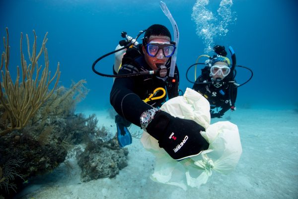 Collecting a plastic bag from the bottom of the sea
