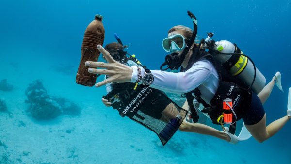 Picking plastic bottles from the bottom of the sea